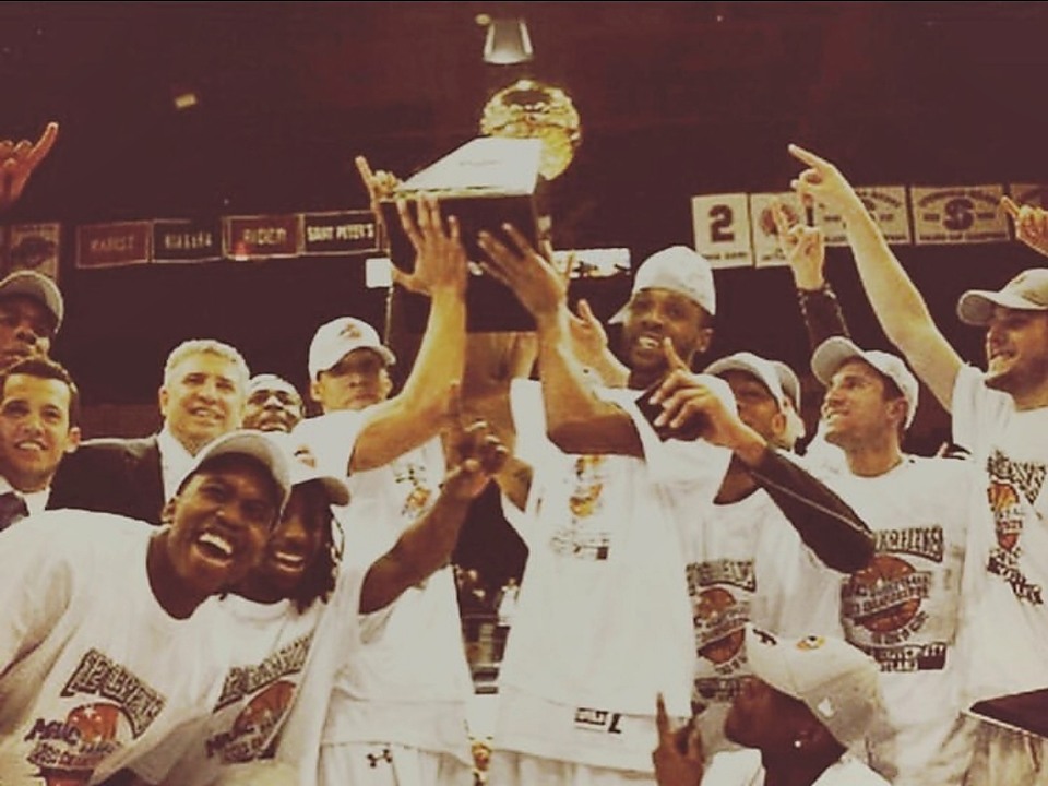Coach Shane celebrating an NCAA Division I championship with his team